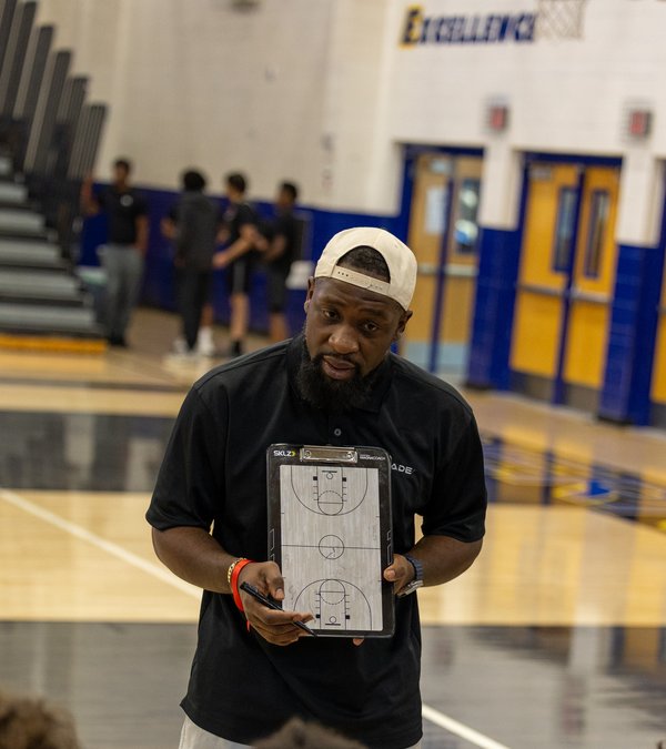 Coach Greg Lewis on the court